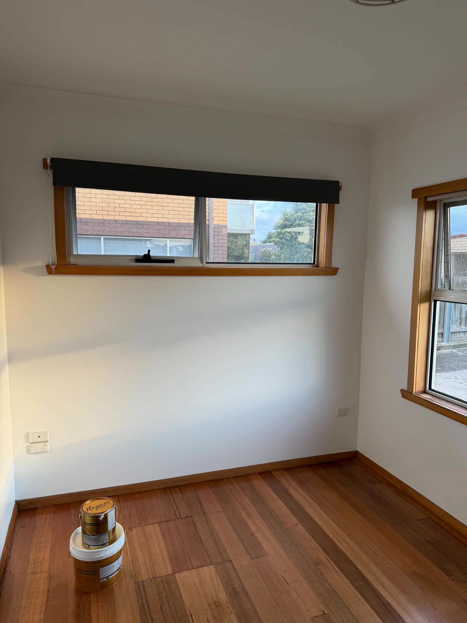 The same bedroom after the repaint, in fresh white